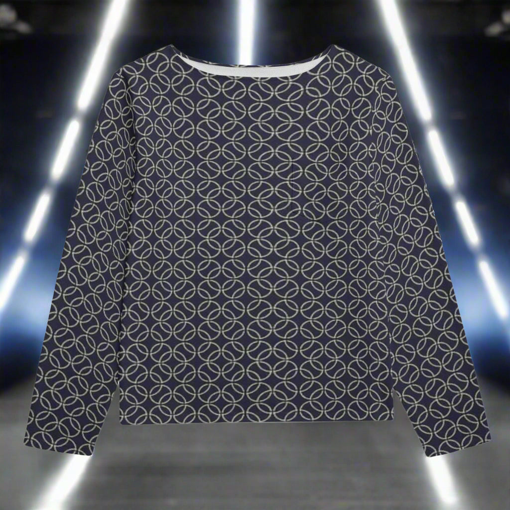 Navy blue sweater with geometric white pattern on a white background