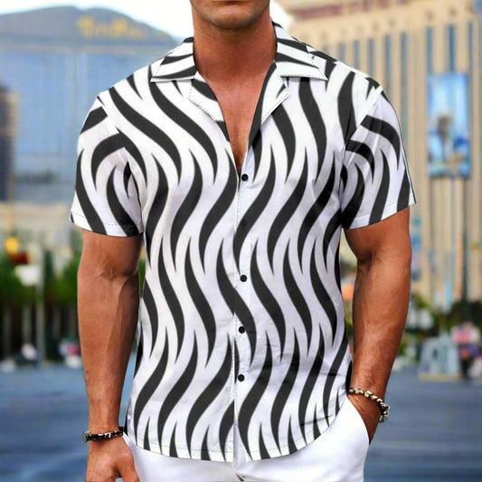 Man wearing a black and white zebra patterned shirt on a white background
