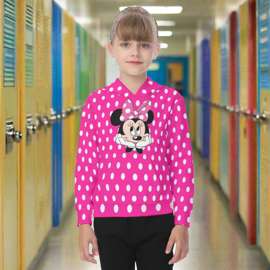 Child wearing a pink polka dot hoodie with a cartoon character on a white background