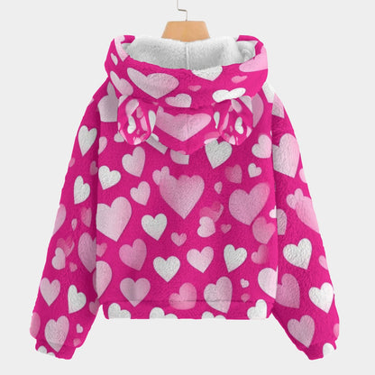 Pink hoodie with heart patterns on a white background
