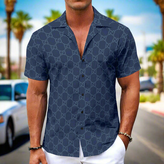 Man wearing a navy blue patterned shirt on a white background