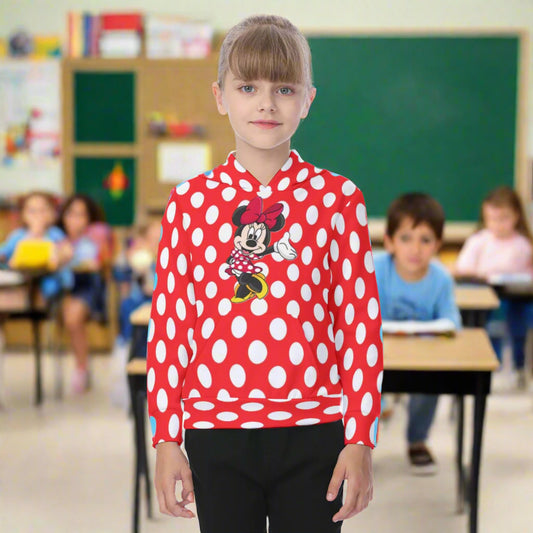 Child wearing a red polka dot hoodie with a character design on a white background