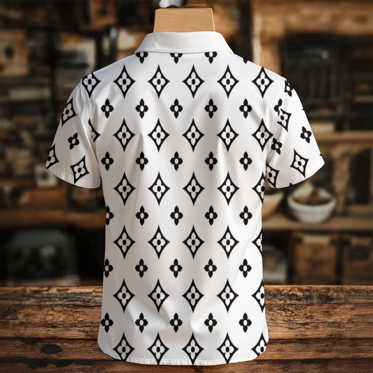 White shirt with black geometric pattern on a wooden surface