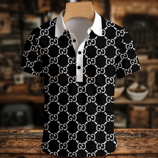 Black polo shirt with white logo pattern on a wooden mannequin against a blurred indoor background