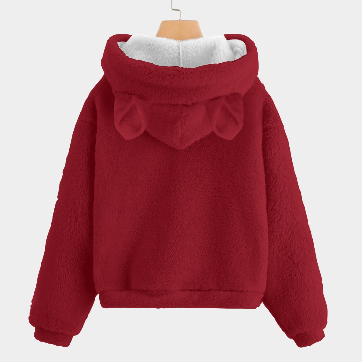 Red fleece hoodie with a white lining on a light gray background