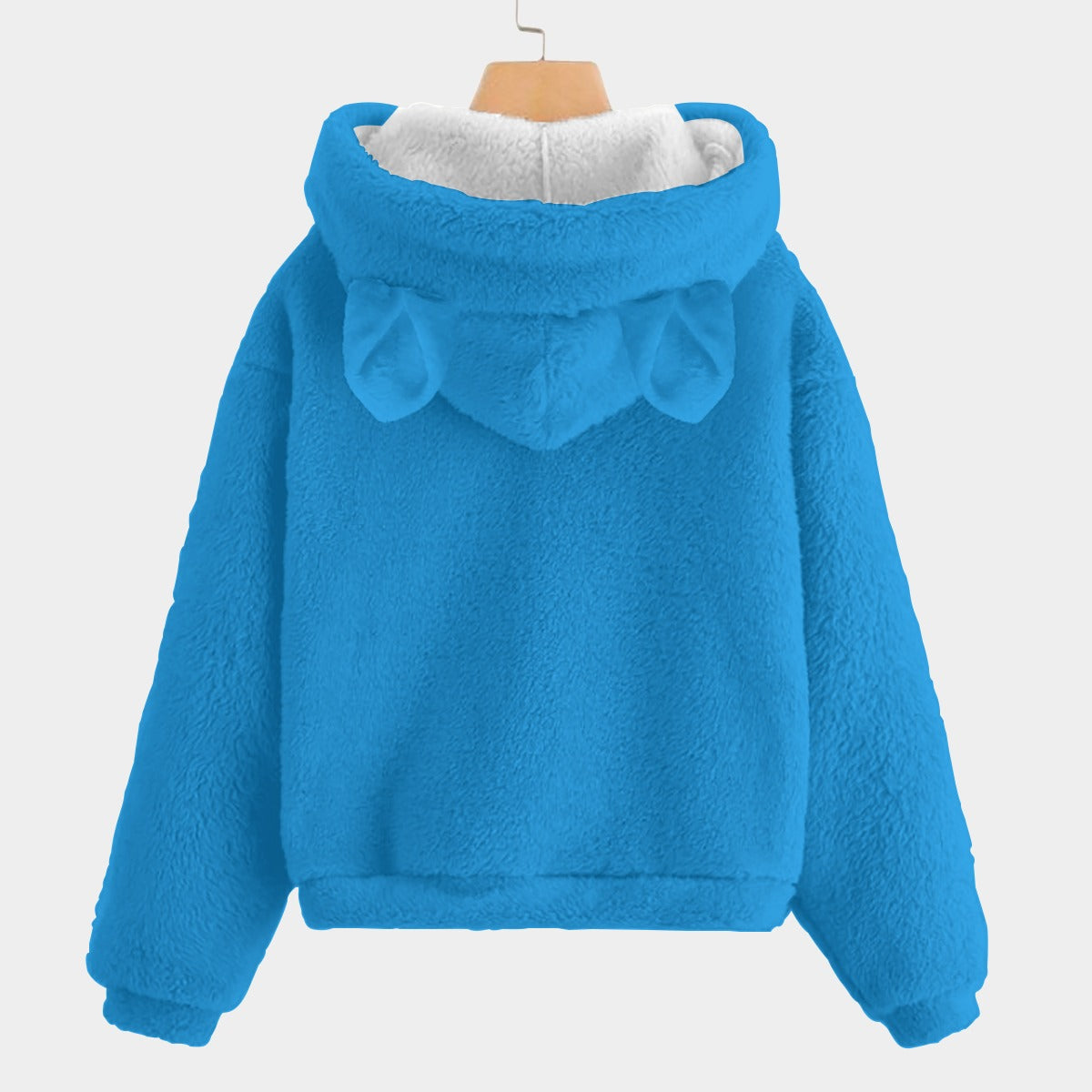 Blue fleece jacket with bear ears on a white background