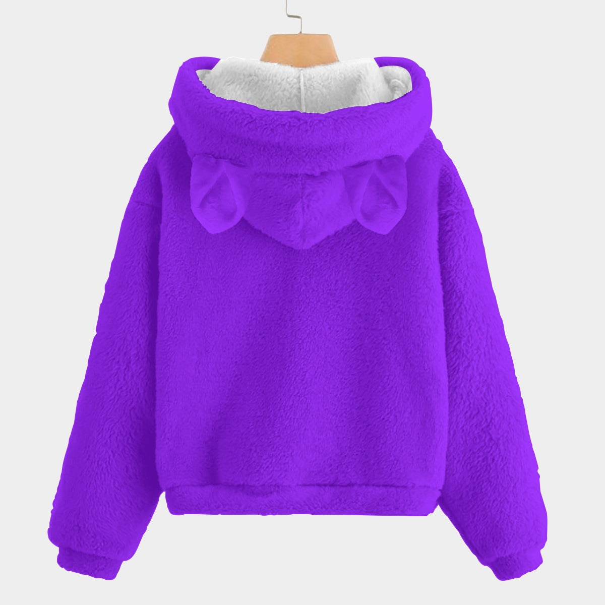 Purple fleece hoodie with a bow on the hood against a white background