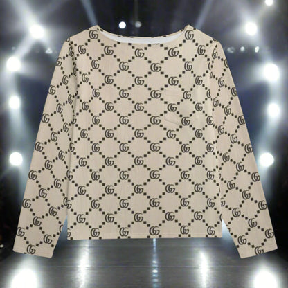 Beige sweater with black pattern on a white background