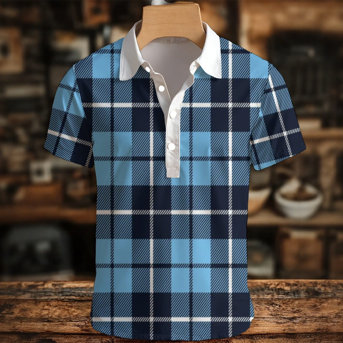 Blue and black plaid shirt on a wooden hanger with a blurred background