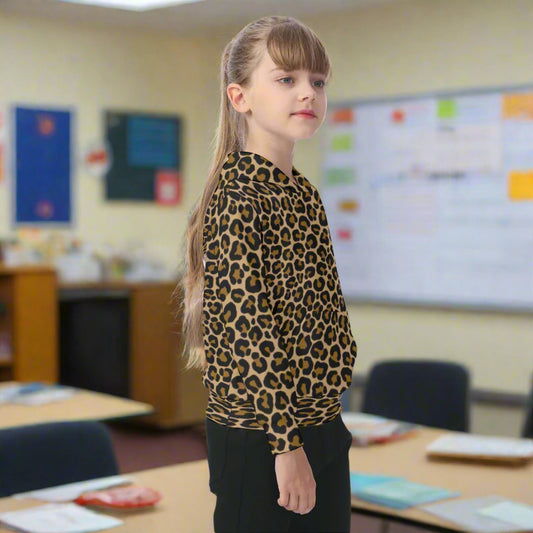 Child wearing a leopard print shirt on a white background