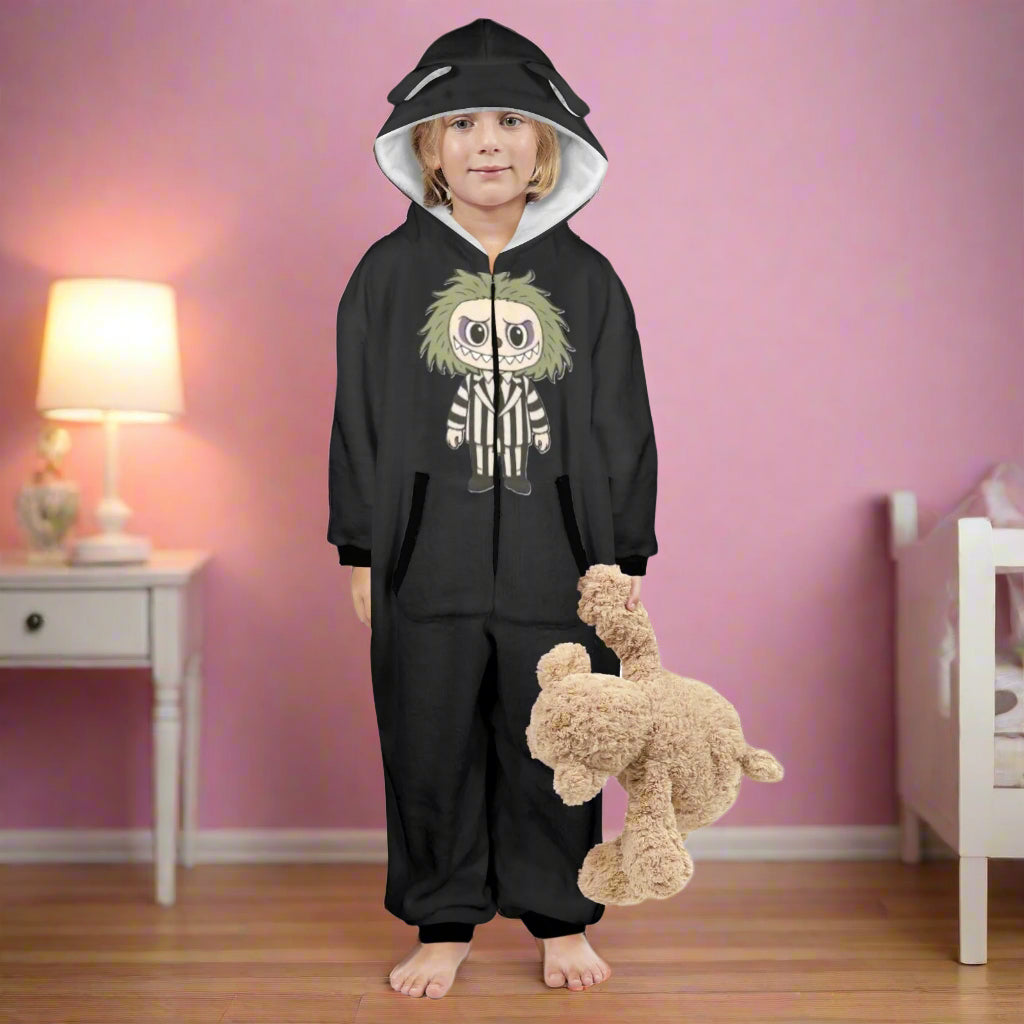 Child wearing a black hoodie with a character design, holding a plush toy on a white background