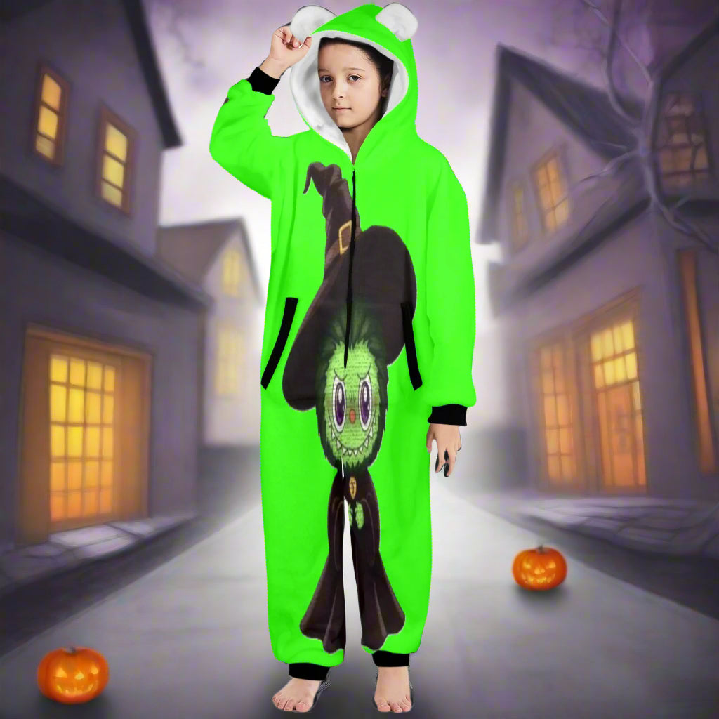 Child wearing a green onesie with a cartoon character on a white background